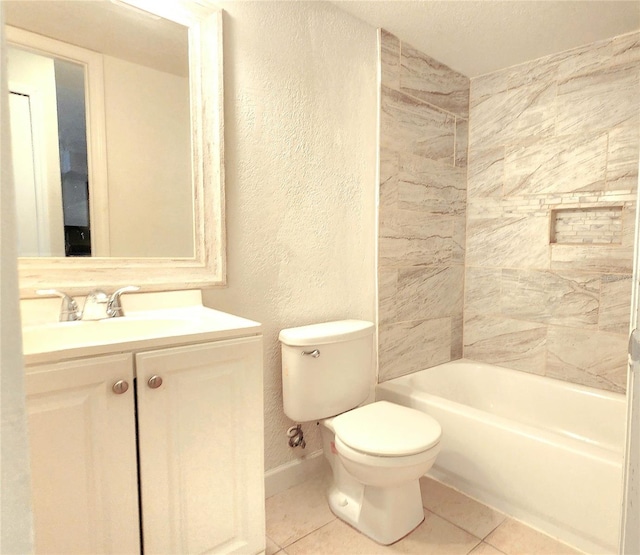 full bathroom with a textured wall, vanity, toilet, and tile patterned floors