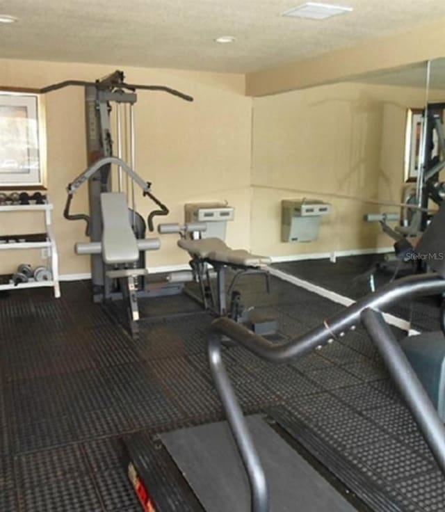 workout area with a textured ceiling