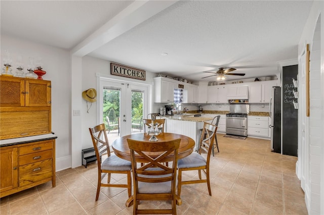 dining area featuring french doors, light tile patterned flooring, and ceiling fan