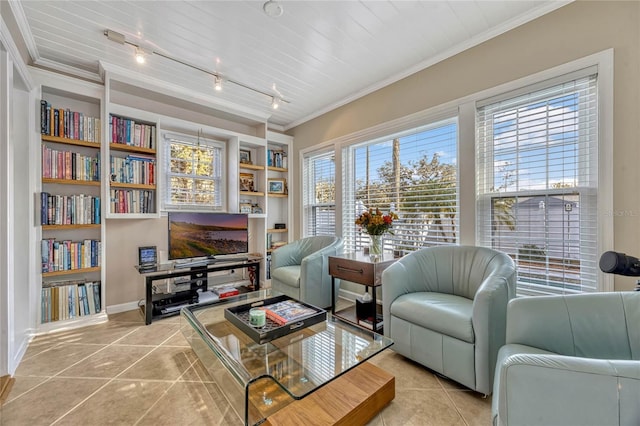 sitting room with rail lighting, tile patterned flooring, built in features, and crown molding