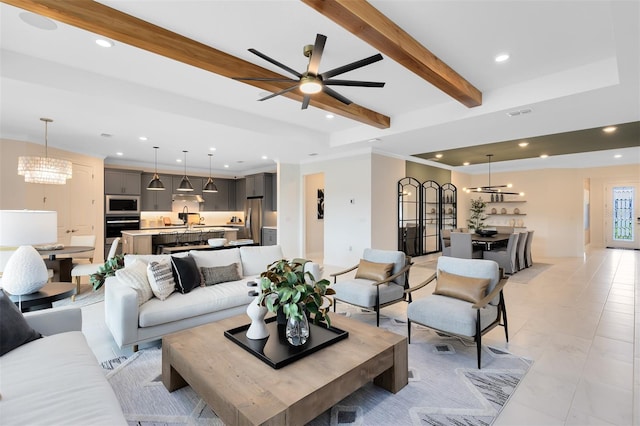 living room featuring light tile patterned floors, an inviting chandelier, beam ceiling, and recessed lighting