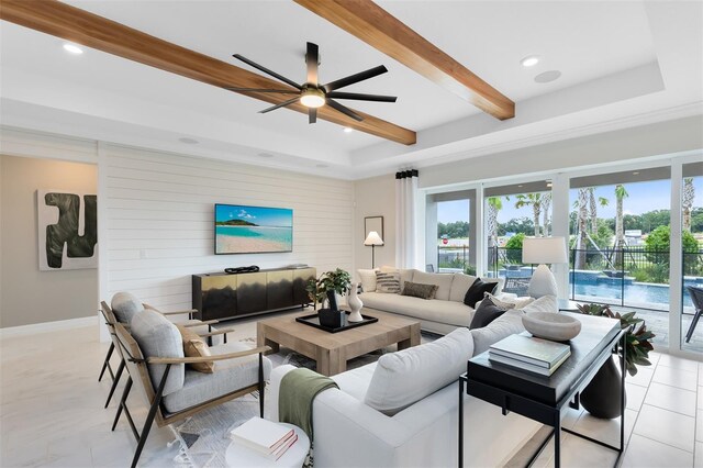 living room with light tile patterned floors, baseboards, beam ceiling, and recessed lighting