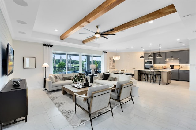 living room featuring baseboards, ceiling fan, beam ceiling, and recessed lighting