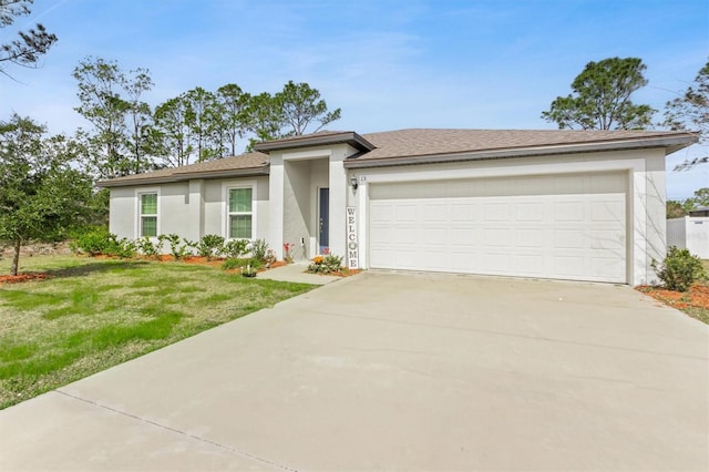 view of front of home with a garage, a front yard, driveway, and stucco siding