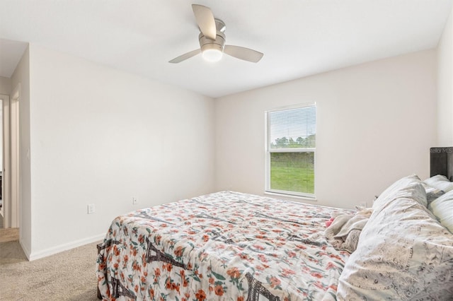 bedroom featuring carpet, a ceiling fan, and baseboards