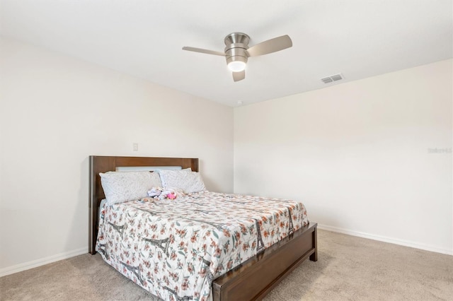 bedroom with a ceiling fan, carpet flooring, visible vents, and baseboards