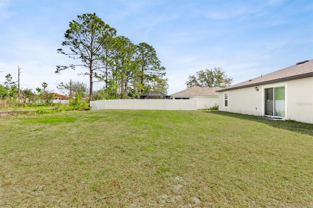 view of yard with fence