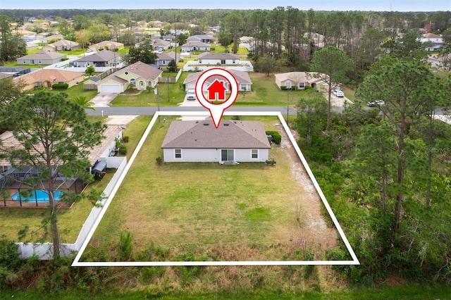 birds eye view of property with a residential view