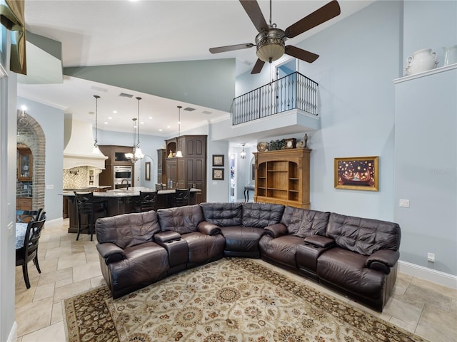 living room with recessed lighting, visible vents, a ceiling fan, high vaulted ceiling, and baseboards