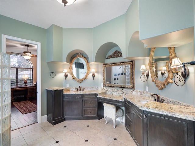 ensuite bathroom with ensuite bath, tile patterned flooring, and vanity