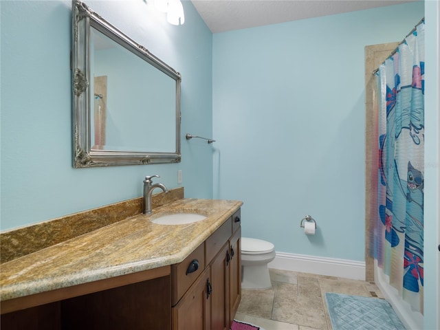 full bathroom with baseboards, vanity, and toilet