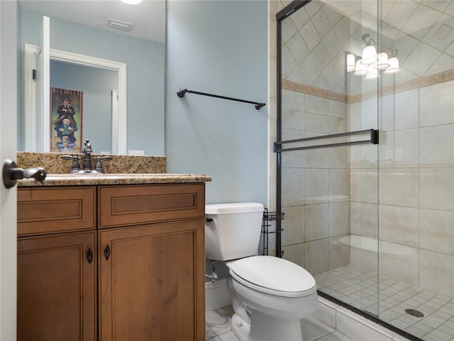 bathroom featuring toilet, a notable chandelier, visible vents, vanity, and a shower stall