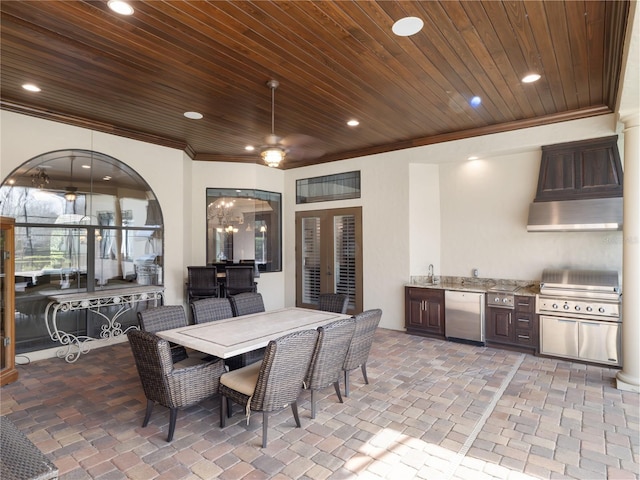 view of patio / terrace featuring outdoor dining space, a ceiling fan, a sink, and area for grilling