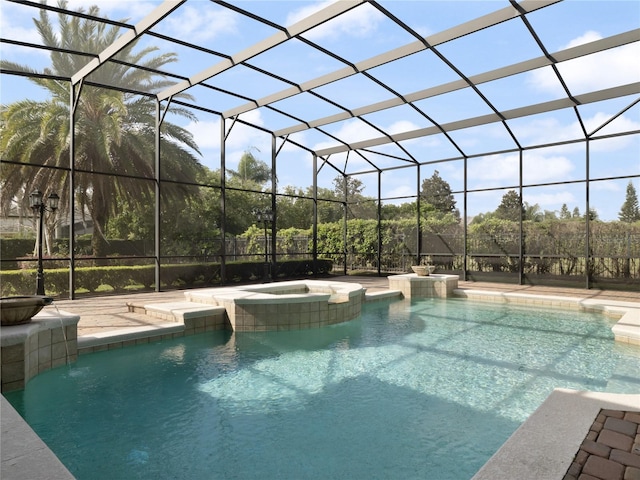 view of swimming pool with a lanai, a patio area, and a pool with connected hot tub