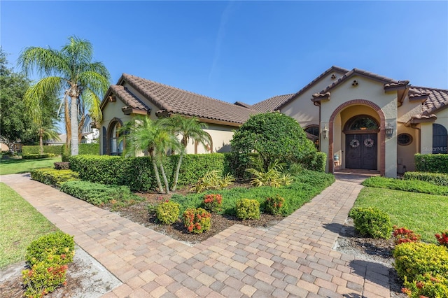 12860 Jacob Grace Ct, Windermere, FL 34786 - mediterranean / spanish house with stucco siding and a tile roof
