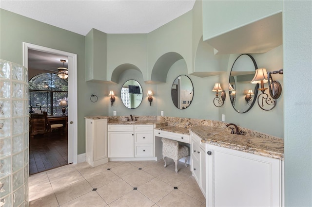 12860 Jacob Grace Ct, Windermere, FL 34786 - bathroom with double vanity and tile patterned flooring