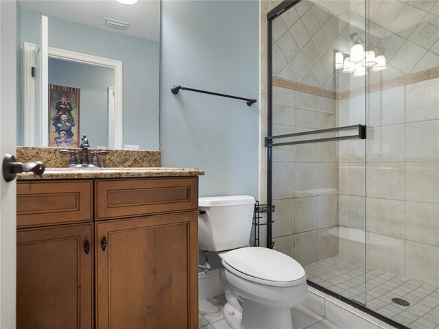 12860 Jacob Grace Ct, Windermere, FL 34786 - full bath featuring a stall shower, toilet, vanity, and tile patterned floors