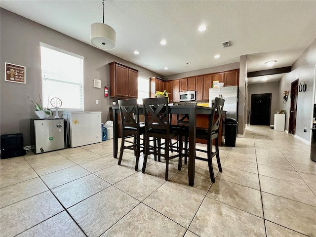 dining room with recessed lighting, visible vents, and light tile patterned floors