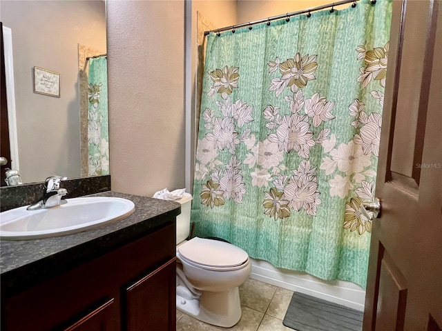 bathroom featuring shower / bath combo with shower curtain, vanity, toilet, and tile patterned floors