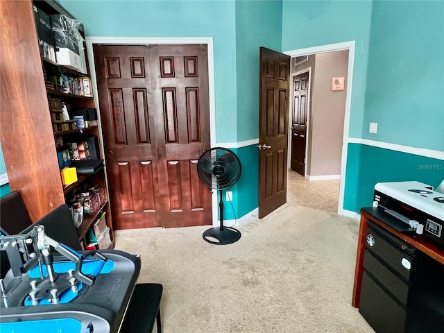 interior space featuring carpet floors and baseboards