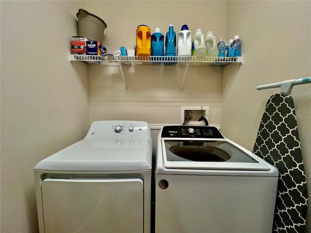 clothes washing area featuring laundry area and washer and dryer