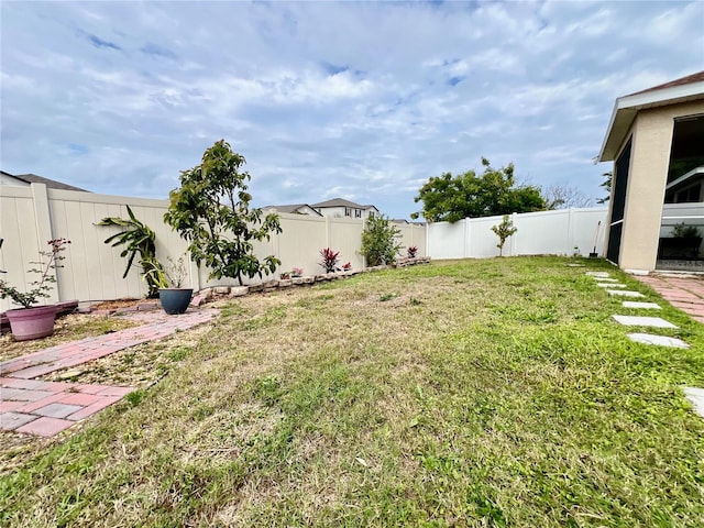 view of yard with a fenced backyard