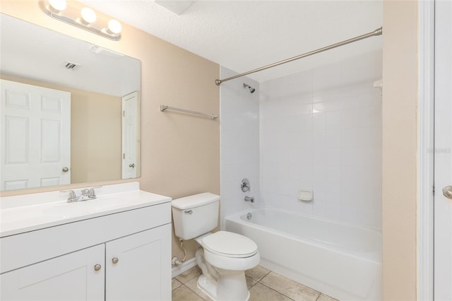 bathroom featuring toilet, tile patterned flooring, a textured ceiling, vanity, and washtub / shower combination