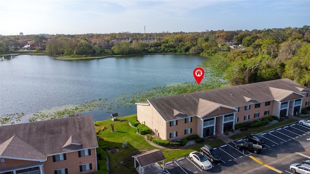 birds eye view of property with a water view