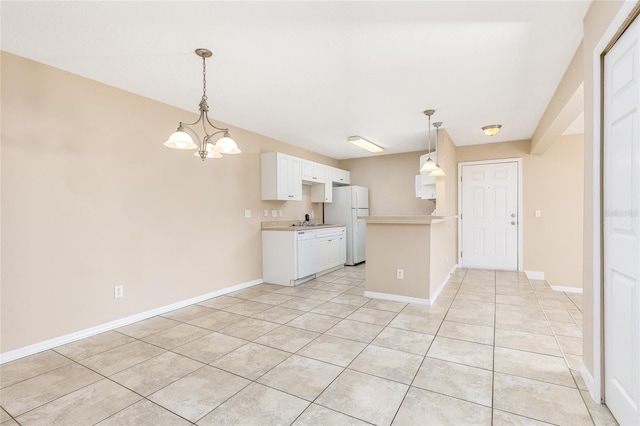 kitchen with a notable chandelier, white appliances, a peninsula, light countertops, and light tile patterned floors