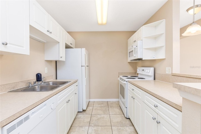kitchen featuring white appliances, open shelves, white cabinets, light countertops, and a sink