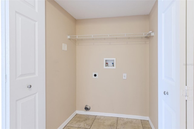 clothes washing area with baseboards, laundry area, hookup for an electric dryer, hookup for a washing machine, and light tile patterned flooring