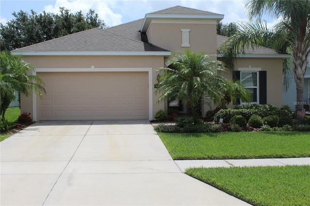 4110 Arlington Ridge Blvd, Leesburg, FL 34748 - view of front of property featuring stucco siding, concrete driveway, a front lawn, an attached garage, and roof with shingles