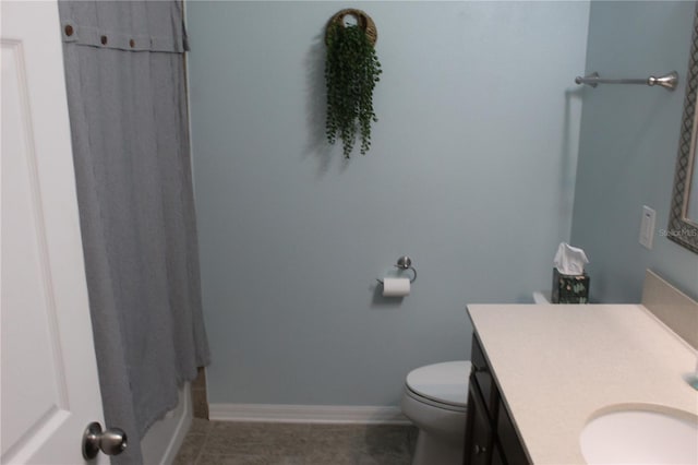 4110 Arlington Ridge Blvd, Leesburg, FL 34748 - full bath featuring vanity, toilet, baseboards, and tile patterned floors