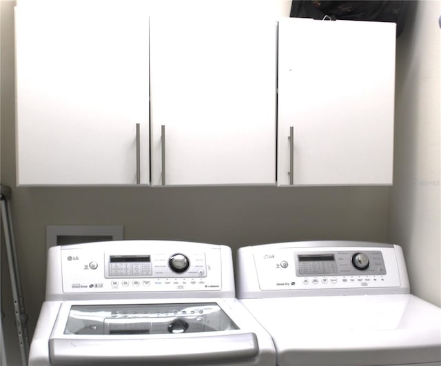 4110 Arlington Ridge Blvd, Leesburg, FL 34748 - laundry area with washer and dryer and cabinet space