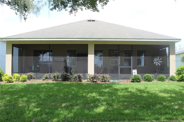 4110 Arlington Ridge Blvd, Leesburg, FL 34748 - back of house with a sunroom, roof with shingles, a yard, and stucco siding