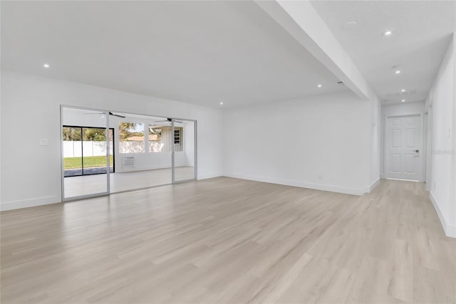 spare room featuring light wood-style flooring, baseboards, ceiling fan, and recessed lighting