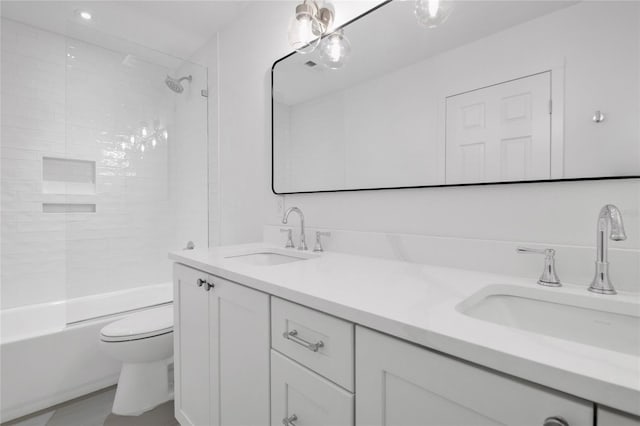 bathroom featuring shower / washtub combination, a sink, toilet, and double vanity