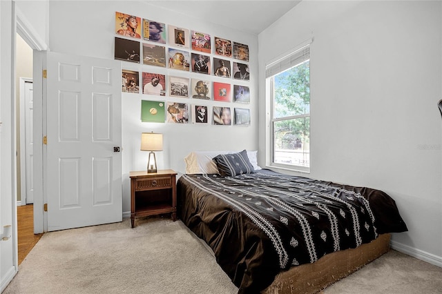 carpeted bedroom with baseboards