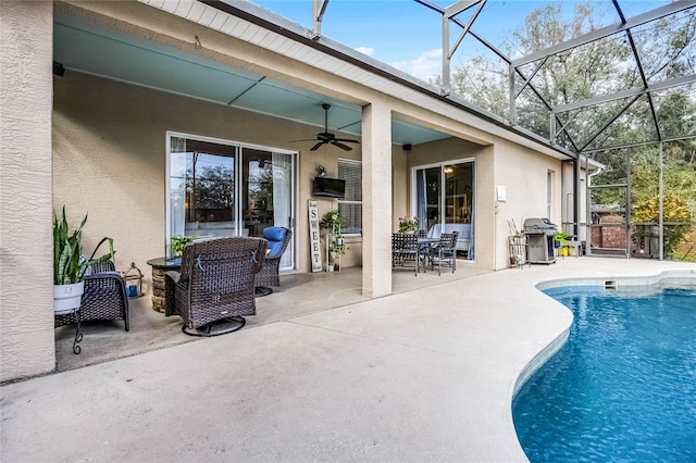 pool with a patio, area for grilling, a lanai, and a ceiling fan