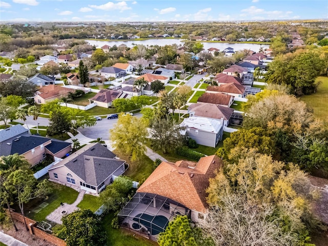 bird's eye view featuring a water view and a residential view