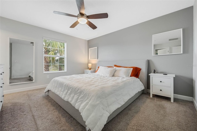 carpeted bedroom with baseboards, visible vents, and ceiling fan