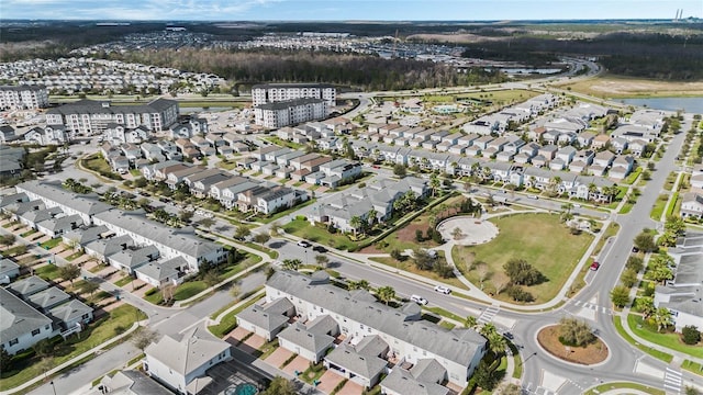 birds eye view of property featuring a water view and a residential view