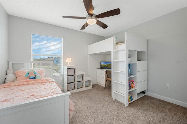 bedroom with ceiling fan, baseboards, and light colored carpet