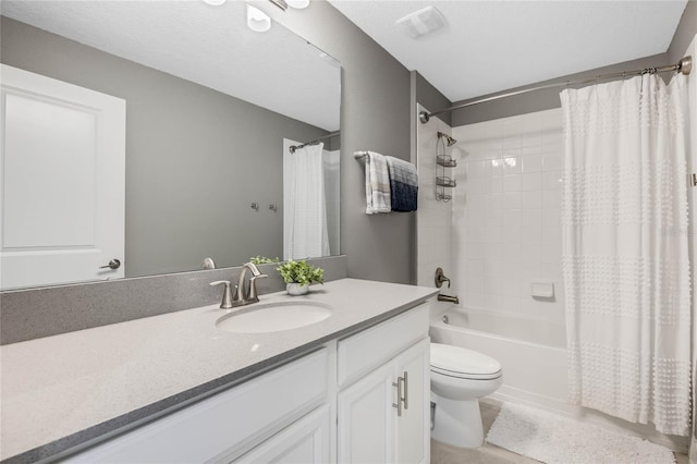 full bathroom featuring toilet, shower / tub combo with curtain, and vanity