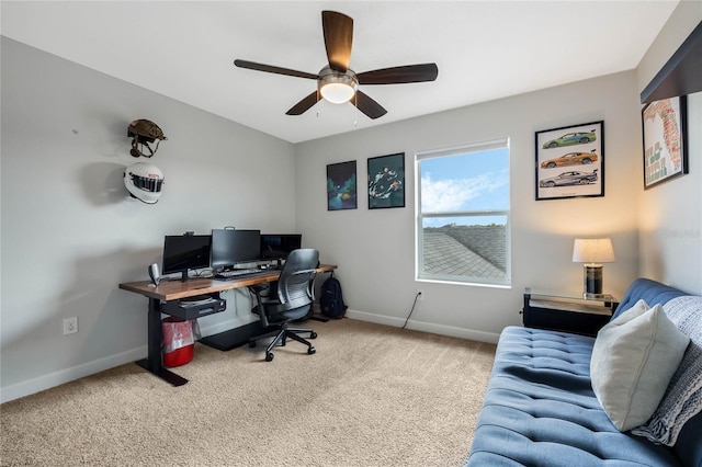 home office with carpet, a ceiling fan, and baseboards