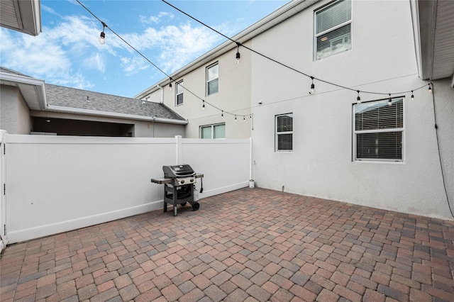 view of patio / terrace featuring area for grilling and fence