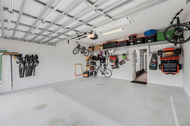 garage with bike storage and a garage door opener