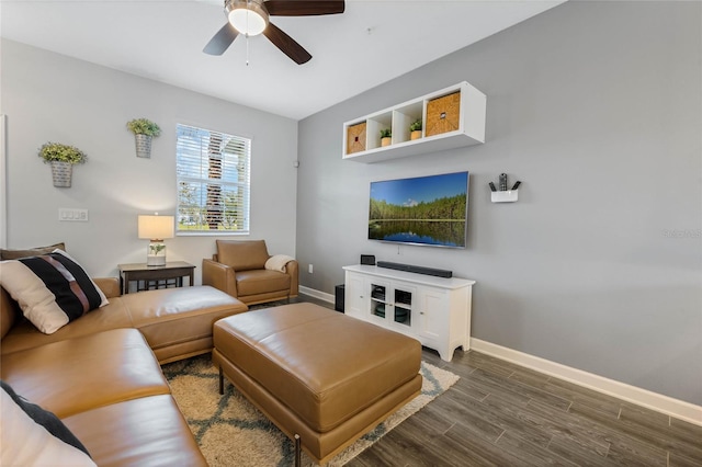 living room with ceiling fan, wood finished floors, and baseboards