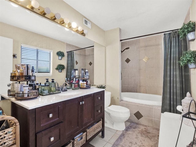 full bath with toilet, tiled shower / bath combo, visible vents, vanity, and tile patterned floors