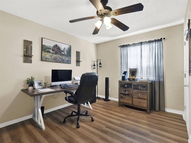 office with a textured ceiling, wood finished floors, and baseboards